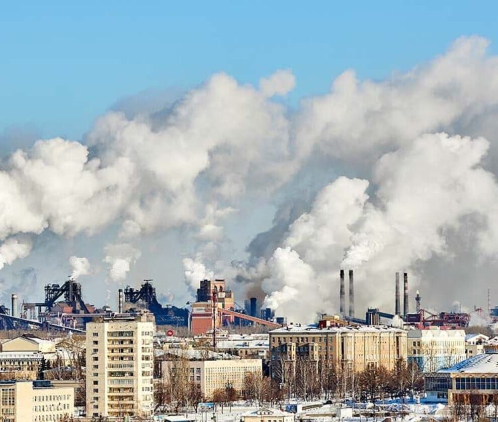 Poor environment in the city. Environmental disaster. Harmful emissions into the environment. Smoke and smog. Pollution of atmosphere by plant factory. Exhaust gases.